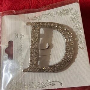 Elegant rhinestone letter “D’ brooch sliver tone